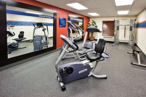 a gym with treadmills and ellipticals in a room at Hampton Inn & Suites Oxford-Anniston in Oxford