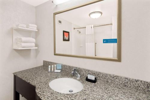 a bathroom with a sink and a mirror at Hampton Inn Atlanta-Georgia Tech-Downtown in Atlanta