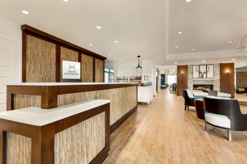 a lobby with a bar and a dining area at Homewood Suites By Hilton Augusta in Augusta