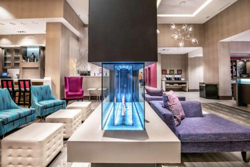 a lobby with blue and purple furniture and a vase at Hampton Inn & Suites Asheville Biltmore Area in Asheville