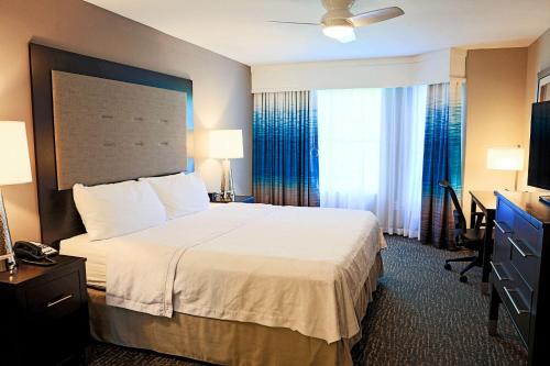 a hotel room with a bed and a desk at Homewood Suites by Hilton Asheville in Asheville