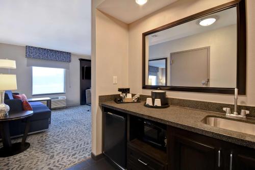 a bathroom with a sink and a large mirror at Hampton Inn & Suites - Columbia South, MD in Columbia