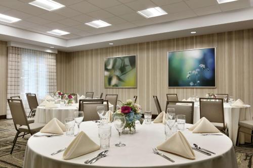 a banquet room with tables and chairs with white tablecloths at Homewood Suites By Hilton Hartford Manchester in Manchester