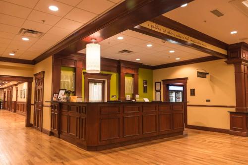 a large lobby with a cash register in a building at Hilton Garden Inn Bangor in Bangor