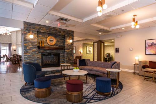 a lobby with a couch and a fireplace at Homewood Suites by Hilton Birmingham-SW-Riverchase-Galleria in Hoover