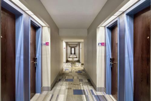 a hallway of a building with blue drapes at Hampton Inn Birmingham-Trussville in Trussville