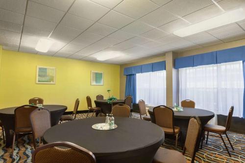 a conference room with two tables and chairs at Hampton Inn Birmingham-Trussville in Trussville