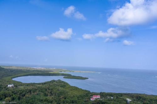 an aerial view of a lake in the ocean at Castles In Paradise Villa Resort in Vieux Fort