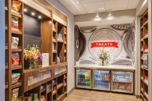 a grocery store aisle with a treats sign on the wall at Hampton Inn & Suites by Hilton Nashville North Skyline in Nashville