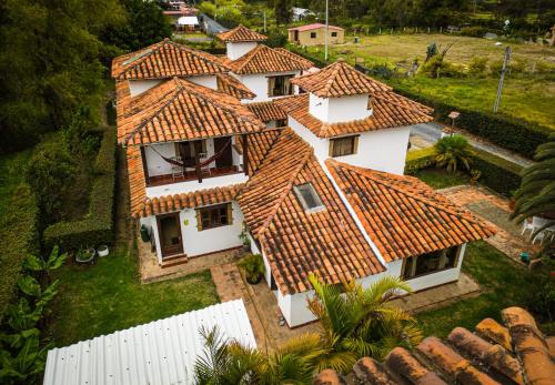 an aerial view of a house with a tile roof at El Pozzo Hotel Campestre in Villa de Leyva