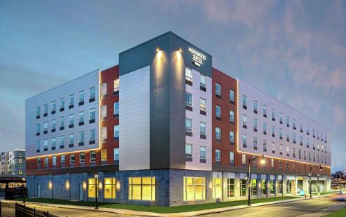 a large building on a city street at night at Homewood Suites By Hilton Boston Logan Airport Chelsea in Chelsea