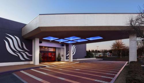 a building with blue lights on the side of it at The Verve Boston Natick, Tapestry Collection by Hilton in Natick