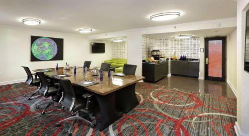 a conference room with a long table and chairs at The Verve Boston Natick, Tapestry Collection by Hilton in Natick