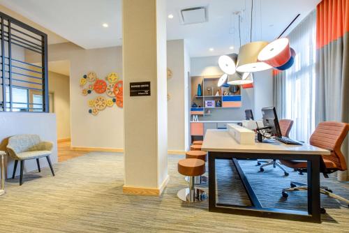 an office with a desk with a computer and chairs at Hampton Inn & Suites Boston/Waltham in Waltham