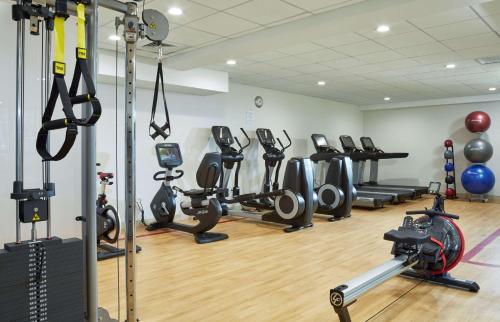 a gym with several treadmills and exercise bikes at DoubleTree by Hilton Hotel Burlington Vermont in Burlington