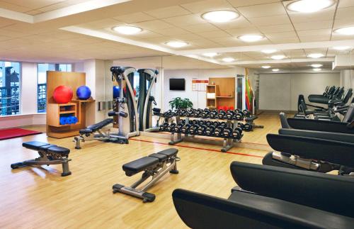 a gym with a lot of treadmills and machines at DoubleTree by Hilton Hotel Burlington Vermont in Burlington