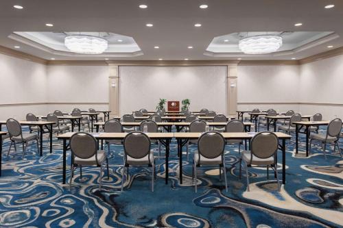 a conference room with tables and chairs on a carpet at DoubleTree by Hilton Hotel Burlington Vermont in Burlington