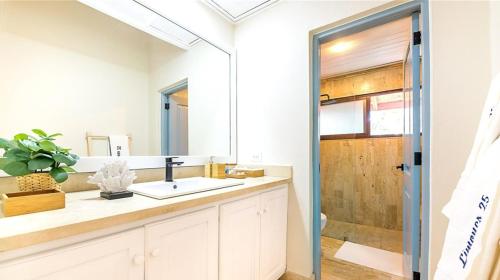 a bathroom with a sink and a mirror at Sunny Vacation Villa No 83 in San Rafael del Yuma