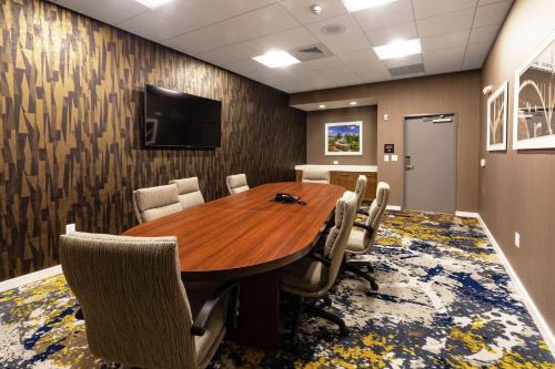 a conference room with a wooden table and chairs at Hampton Inn & Suites By Hilton-Columbia Killian Road in Killian