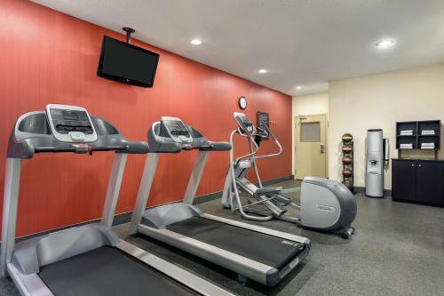 a gym with a treadmill and a flat screen tv at Hampton Inn Akron-Fairlawn in Montrose