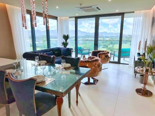 a living room with a table and a couch at Mullet Bay Suites - Your Luxury Stay Awaits in Cupecoy