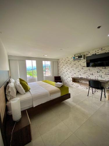 Postel nebo postele na pokoji v ubytování HOTEL RIVERA CENTRAL