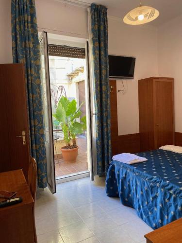 Postel nebo postele na pokoji v ubytování Guest House Pitagora