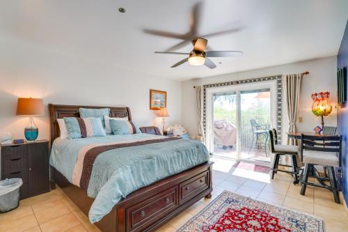 a bedroom with a bed and a ceiling fan at Scenic Tucson Vacation Rental with Patio and Grill! in Tucson