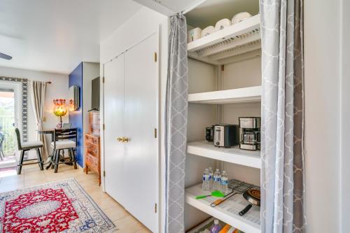 a room with a closet with white shelves at Scenic Tucson Vacation Rental with Patio and Grill! in Tucson