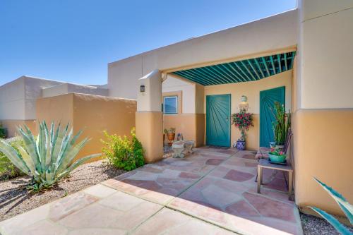 a house in the desert with a patio at Scenic Tucson Vacation Rental with Patio and Grill! in Tucson