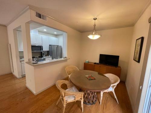 a kitchen and dining room with a table and chairs at 1 Bedroom & Office Near Caltrain and Stanford in Palo Alto