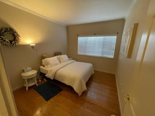 a small bedroom with a bed and a window at 1 Bedroom & Office Near Caltrain and Stanford in Palo Alto