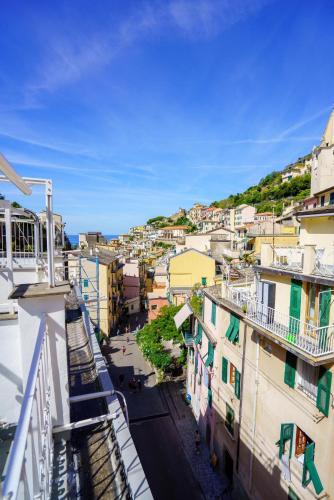 a view of a city from the balcony of a building at Sotto Sale-5 Terre affittacamere in Riomaggiore