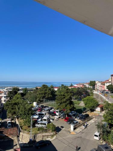 a view of a parking lot and the ocean at Anatolia SUITE APART in Bostancı