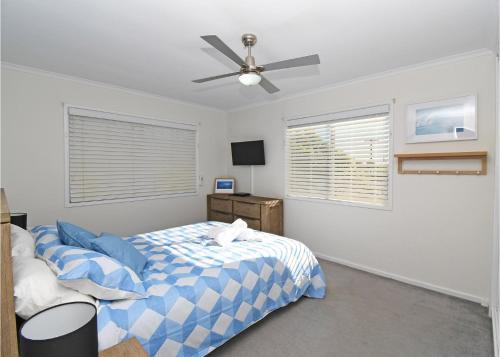 Säng eller sängar i ett rum på Sandy Shores in Hervey Bay