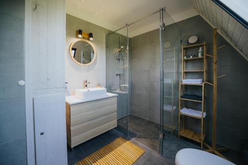 a bathroom with a sink and a shower at Grafit Kabin in Nagykanizsa