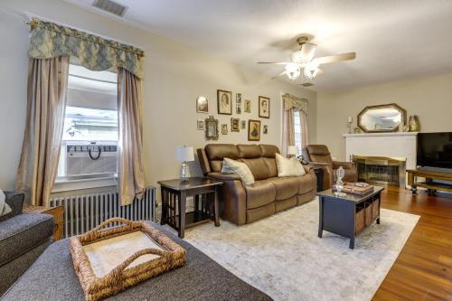 a living room with a couch and a tv at 3 Mi to Dtwn Springfield Home with Deck! in Springfield