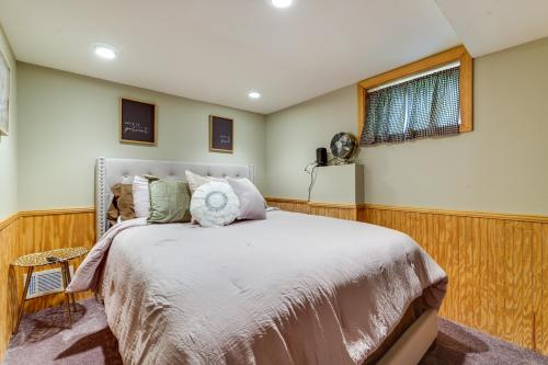 a bedroom with a bed and a window at 3 Mi to Dtwn Springfield Home with Deck! in Springfield
