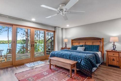 a bedroom with a bed and a ceiling fan at Equanimity in Eagle River