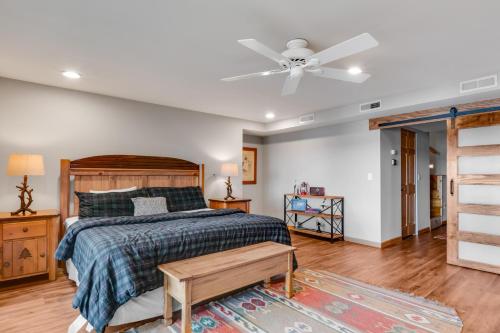 a bedroom with a bed and a ceiling fan at Equanimity in Eagle River