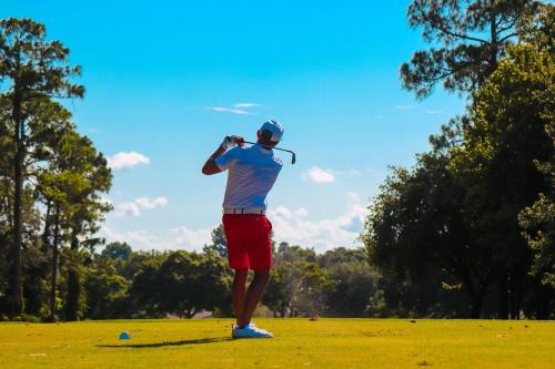 a man is playing golf on a field at Oporto, sea view and marina in Canidelo
