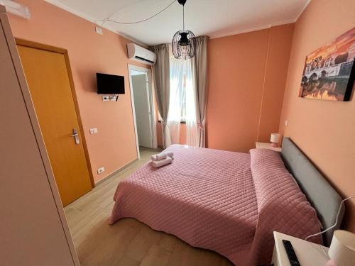 Postel nebo postele na pokoji v ubytování Affittacamere L'Aurora