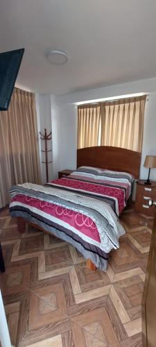 Una cama o camas en una habitación de R. A. C. S.