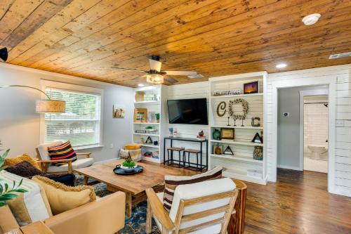 a living room with a wooden ceiling at Lindale Vacation Rental with Deck and Grill! in Lindale