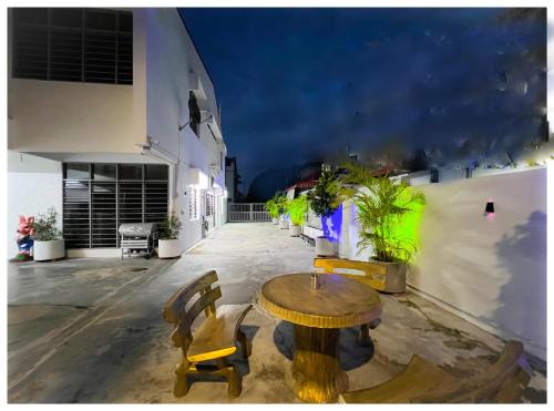 a patio with a table and chairs on a building at ✩ 23 HOUSE ✩ 23号 复古老宅 ✩ Vintage Homestay in Butterworth