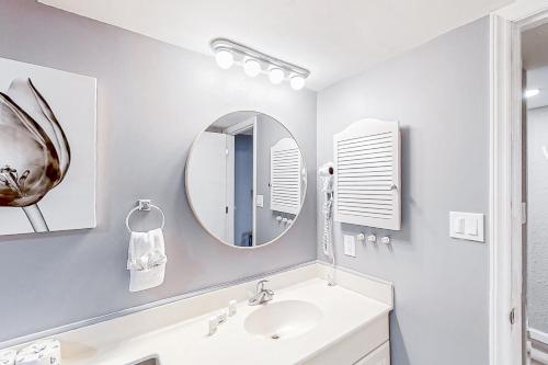 a bathroom with a sink and a mirror at Sands Ocean Club 1630 in Myrtle Beach