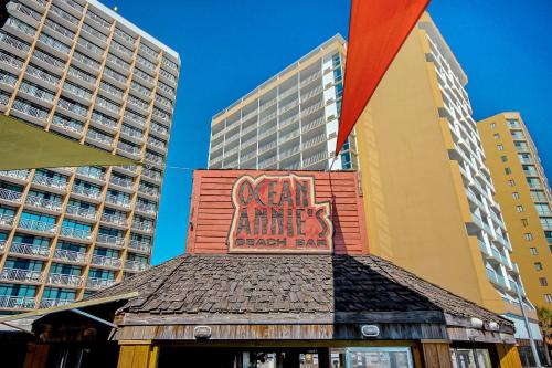 a sign on the side of a building with tall buildings at Sands Ocean Club 1630 in Myrtle Beach