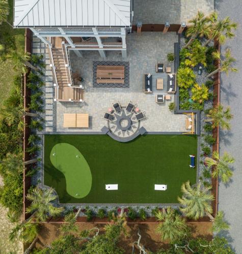 an overhead view of a house with a yard at Beachfront Pool Outdoor Kitchen Firepit Putting Green in Folly Beach
