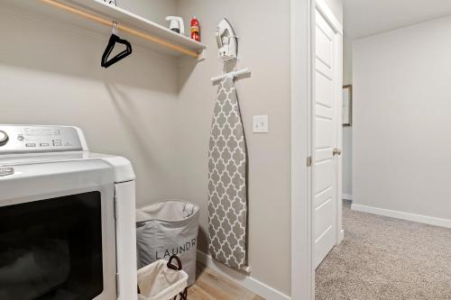 a tie hanging on a wall next to a door at Mineral Soak Rockers Fire Pit Game Room Fun in Meridian