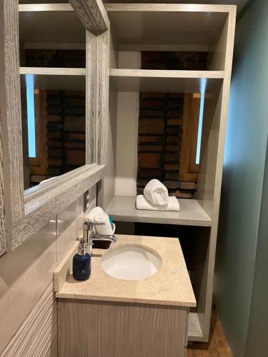 a bathroom with a sink and a mirror at Hotel Casa Carmona in Querétaro